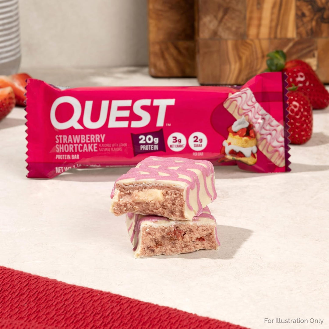 Savor the sweet taste of Quest Strawberry Shortcake Protein Bars, packed with real strawberry pieces and creamy white chocolate chunks. Each bar delivers 20g high-quality protein, only 3g net carbs, 10g fiber, and just 2g sugar, making it a perfect keto-friendly, gluten-free snack. Ideal for on-the-go energy, post-workout recovery, or a healthy dessert, these bars help fuel muscle growth and maintain balanced macros while satisfying your strawberry shortcake cravings without added sugar.