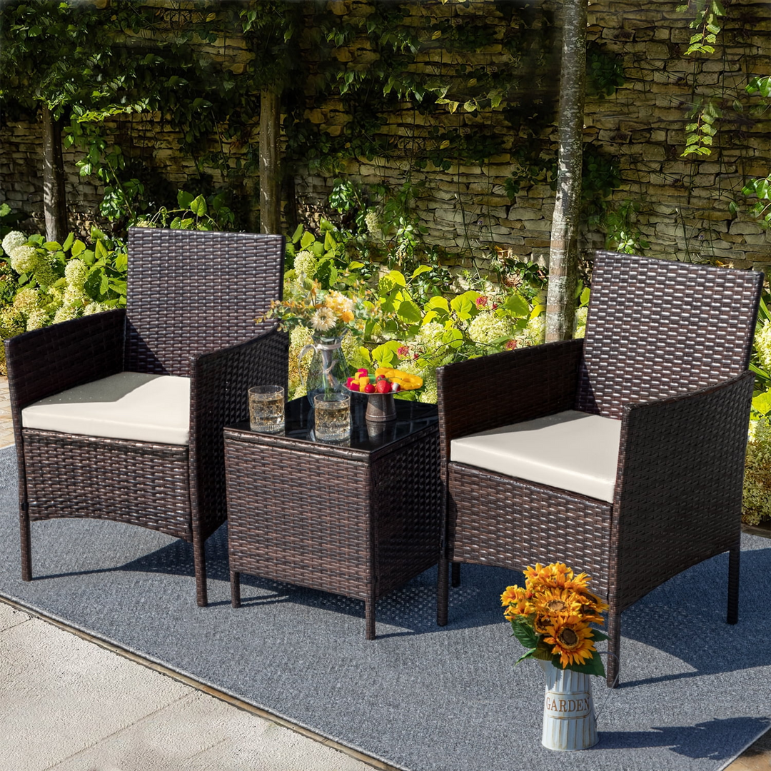 Poolside ROKA patio furniture set with glass coffee table and cushioned rattan chairs